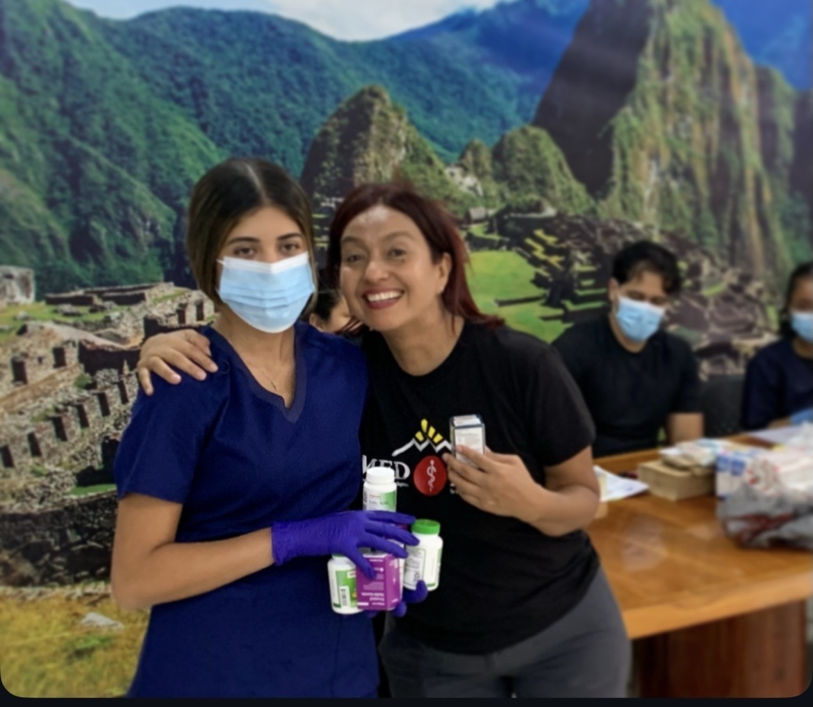 Healthcare volunteers with essential medications and vitamins for communities in Lima, Peru